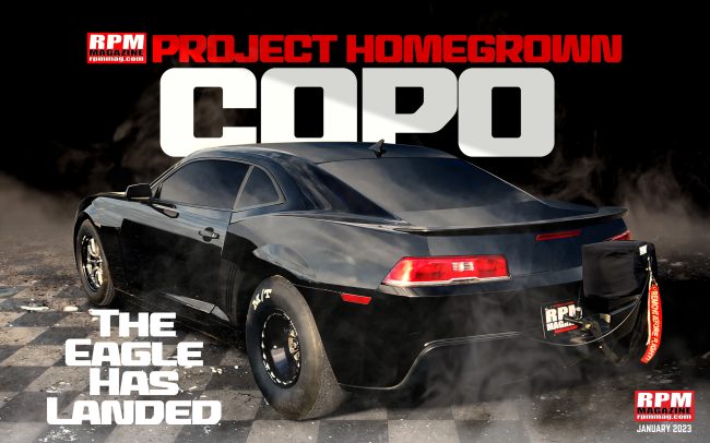 Black COPO Camaro on checkered flooring